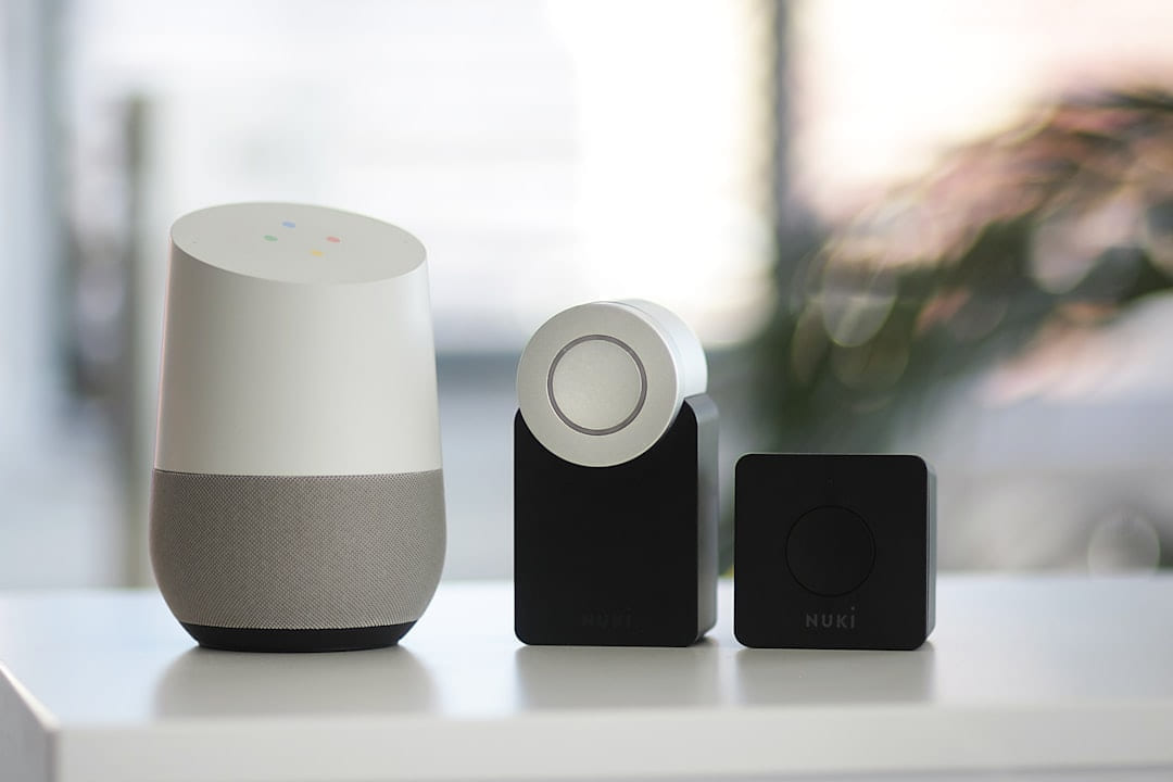 white and gray Google smart speaker and two black speakers on Affordable Smart Living
