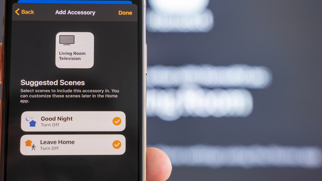 person holding black iphone 5 on Affordable Smart Living