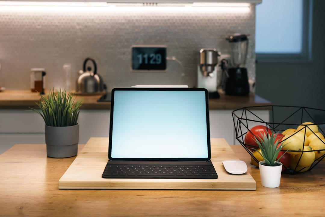 Laptop, mouse, and fruit on a kitchen counter. on Affordable Smart Living